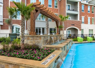 The Julian at South Pointe pool with fountains and lounge chairs