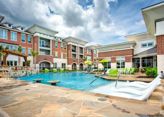 The Julian at South Pointe pool with fountains and lounge chairs